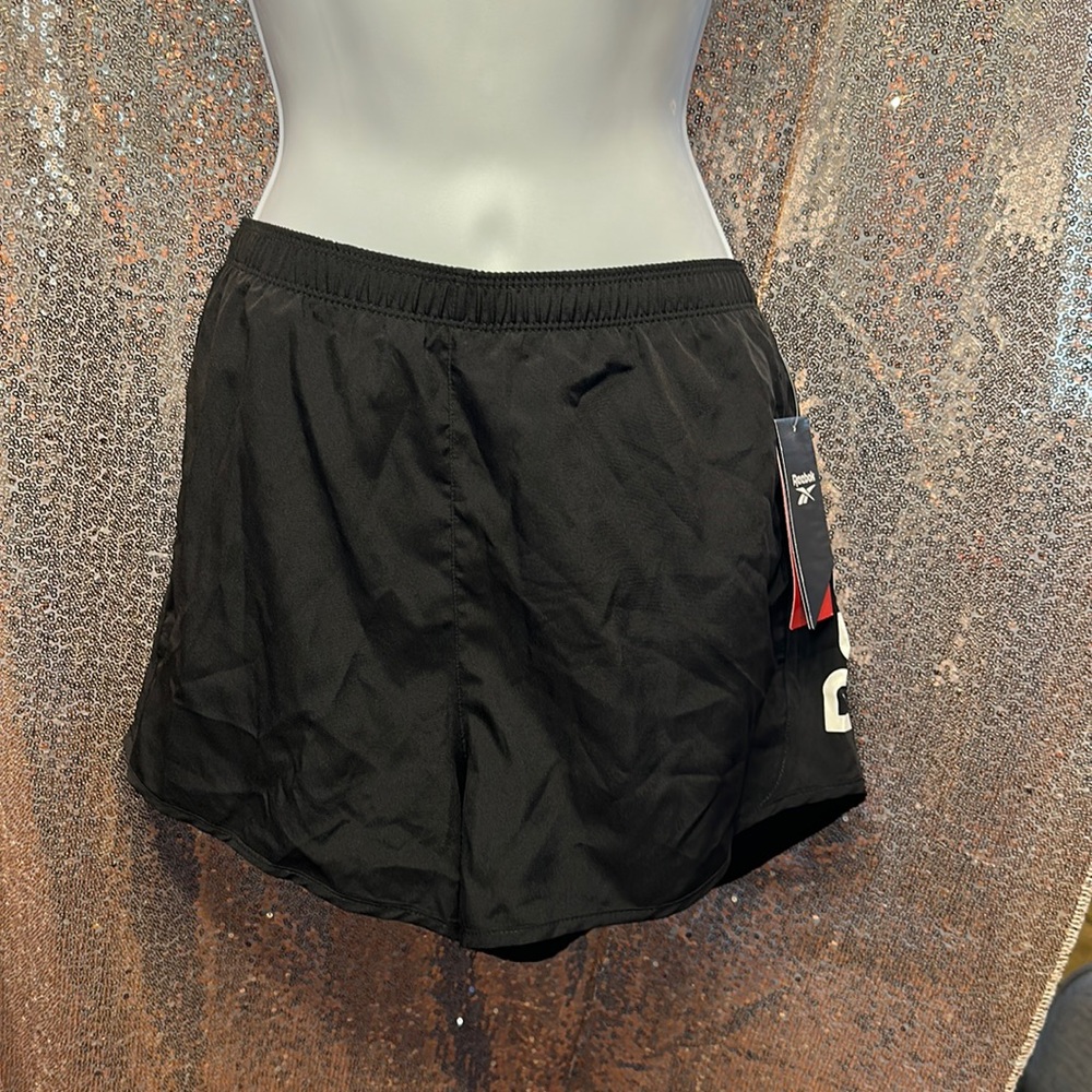 Reebok Womens size L black running short. New with tag